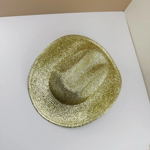 Detailed close-up of sparkling gold glitter texture on a festive St. Patrick's Day party hat