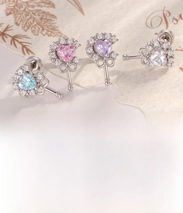 Detail of heart scepter earrings with colorful zircons and size specifications