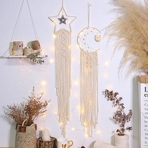 Bohemian moon and star macrame wall hanging with wooden owl and warm LED string lights
