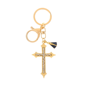 Detailed view of golden cross keychain with white rhinestones and blue enamel charm