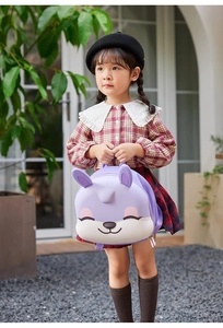 Detail of cute rabbit toddler backpack in purple with 3D ears in outdoor setting