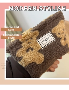 Detail of plush lamb wool bottle sleeve with cute bear pattern and party label