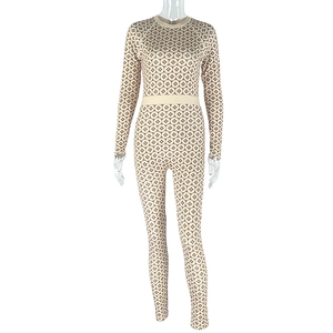 Detail of slim fit beige bodysuit with brown geometric prints and elastic waistband