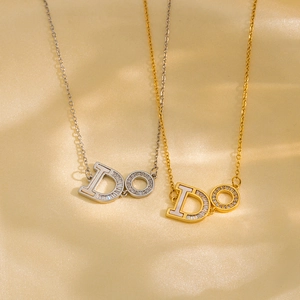 Luxurious gold and silver DO letter pendant necklaces with shell inlay and crystals on silk