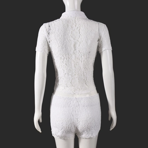 Detail view of the back of a white lace two-piece set featuring intricate floral crochet texture