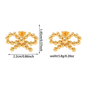 Detailed view of 18K gold bow knot heart earrings with dimensions and weight info