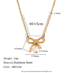 18K gold plated bow necklace with freshwater pearl pendant on a white background