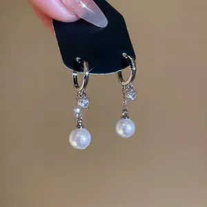 Elegant French zircon pearl tassel earrings in S925 silver on a black display card