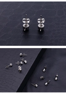 Macro view of stainless steel earring studs with butterfly backs and zircon inlay