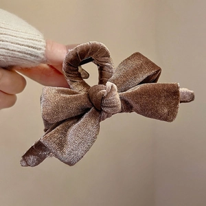 Elegant large brown velvet bow hair claw clip for women with premium textured finish
