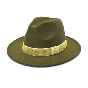 Detail of olive green wool fedora hat featuring a sparkling gold sequin ribbon band