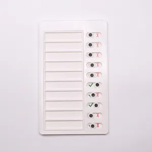 Detail view of white plastic RV checklist memo board with 10 sliders for daily task tracking