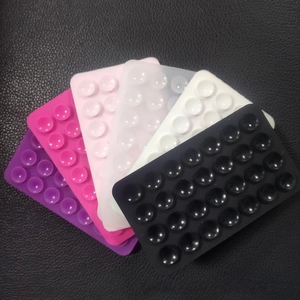 Detailed view of rectangular silicone suction cup pads in multiple vibrant colors