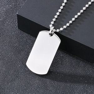 Polished silver stainless steel dog tag necklace with classic bead chain on black box