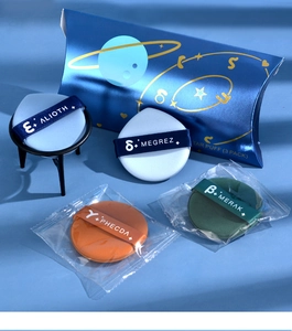 Detail shot of non-latex air cushion puffs with star names in a blue cosmic box
