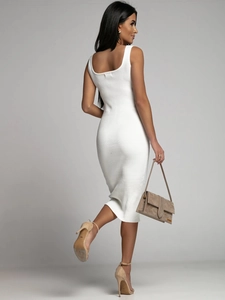 Detail of white sleeveless ribbed knit dress showing texture and midi length from back view