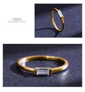 Macro detail of gold-plated S925 silver ring with rectangular zircon on navy background