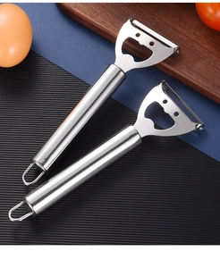 Close-up of stainless steel 2-in-1 peeler and bottle opener with hanging hole design
