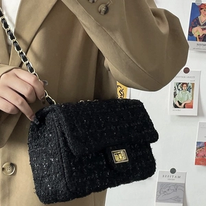 Classic black tweed crossbody bag with golden square lock and metal chain strap