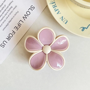 Fresh candy-colored pink flower claw clip with cream borders in a glossy jelly finish.