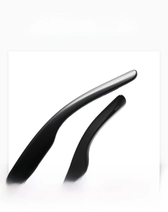 Detailed macro view of the glossy black resin temples on these oval star sunglasses