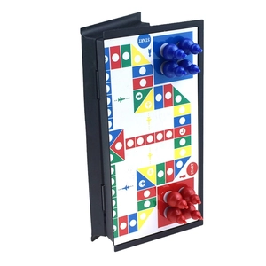 Detail of portable folding magnetic Ludo board with 3D game pieces and colorful path