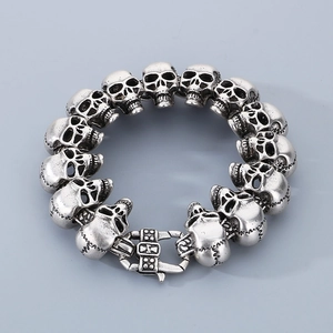 Detailed view of punk retro skull chain bracelet with silver oxidized finish and metal clasp