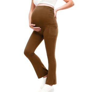 Detail of high-waisted maternity yoga leggings with side pockets in coffee brown