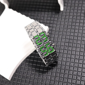 Close-up of silver steel band LED watch with green digital display on a white display stand
