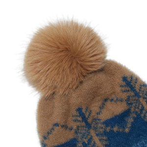 Close-up of winter knit hat featuring snowflake patterns and a fluffy faux fur pom-pom