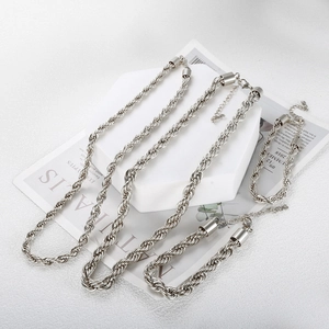 Detail of silver stainless steel twisted rope chain necklaces and bracelets set