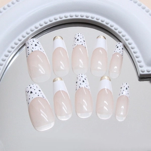 Handmade leopard press-on nails with 3D gold foil and French style coffin shape