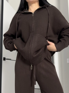 Brown knitted two-piece set featuring a hooded double-zip sweater and high-waist pants