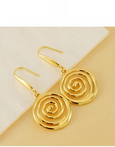 Detailed view of golden triple spiral geometric earrings made of durable titanium steel