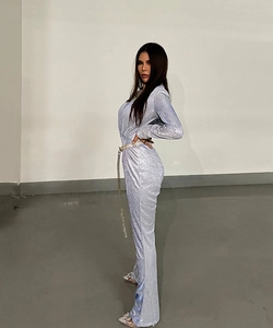 Slim fit light blue sequin jumpsuit with deep V-neck and silver decorative belt