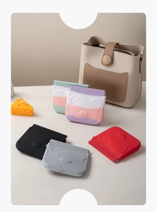 Detailed view of colorful bear-shaped silicone storage pouches in various pastel gradients