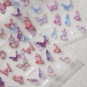 Holographic butterfly nail stickers M-339 with gold outlines on textured stone background