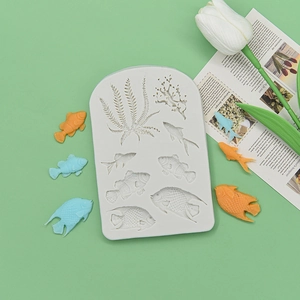 Silicone fondant mold featuring diverse sea fish and seaweed shapes for cake decorating