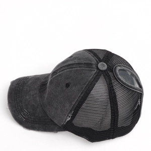 Detail of washed cotton ponytail baseball cap with mesh back and side goggles