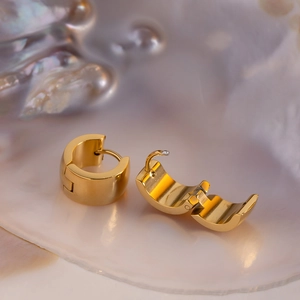 Polished 18K gold-plated stainless steel thick huggie earrings with a hinged closure
