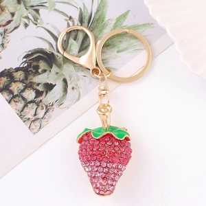 Detailed view of luxury strawberry keychain featuring pink and red sparkling rhinestones