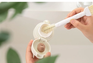 Detail view of the 3-in-1 multi-functional cleaning brush for bottle lids and gaps