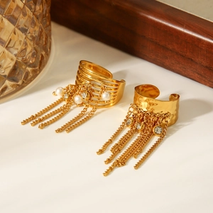 Detailed view of gold tassel ear cuffs with pearls and zircons in an elegant setup