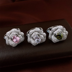 Three elegant floral rings with sparkling zircon petals and colorful center stones