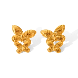 Detail shot of dual 18K gold-plated butterfly stud earrings with delicate textured wings