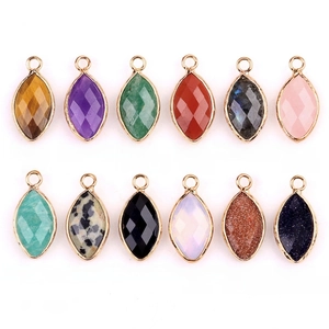 Faceted marquise gemstone pendants with gold plated edges in various natural stones