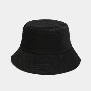 Detail shot of black terry cloth bucket hat featuring reinforced brim stitching and soft texture