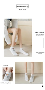 Detail of white cotton ankle socks featuring cute orange duck embroidery and high elastic cuff
