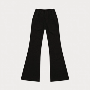 Detail of black cotton flared sweatpants featuring an elastic waist and soft knit texture