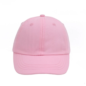 Detail of light pink kids' baseball cap showing cotton twill texture and 6-panel design